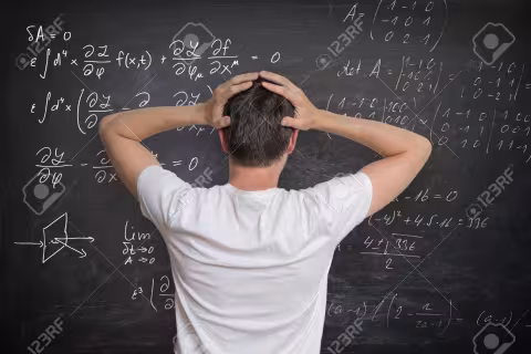 Man looking at equations in distress